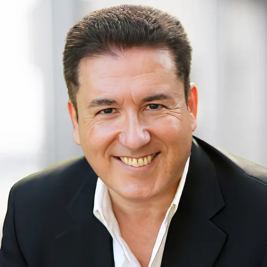 a man in a suit smiling