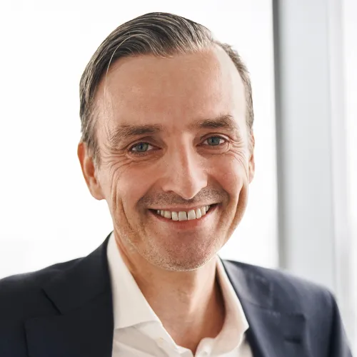 a man smiling at the camera