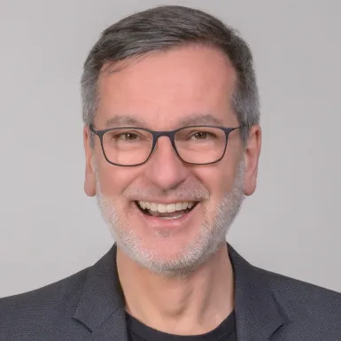 a man smiling for a picture